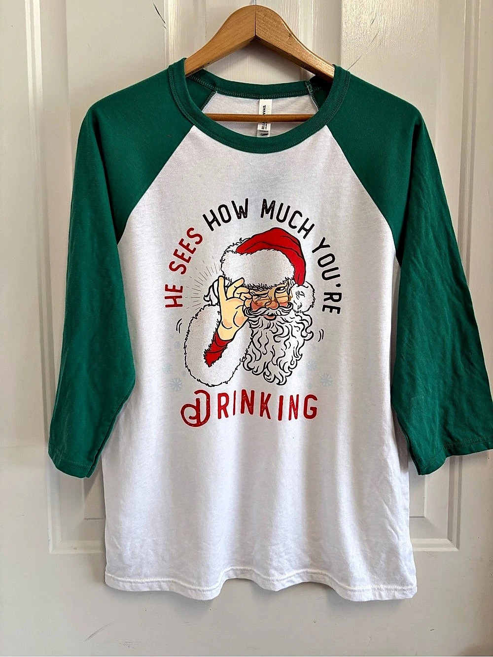 Christmas Santa’s see your drinking Bella Canvas Men's Cotton Raglan Graphic Tee